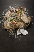 Oysters with seaweed and pomegranate seeds