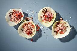 White cabbage roulades with tapenade and salsiccia