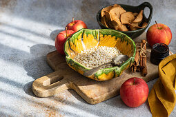 Oats, apples and cinnamon sticks for a healthy breakfast