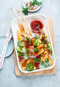 Glass noodle salad with spring rolls