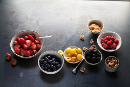 Fruit in bowls on a black background