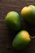 Mangoes on a wooden table