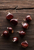 Chestnuts on a wooden table