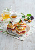 Sponge cake slices with plums