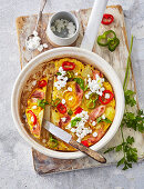 Spanish tortilla de patatas with ham, vegetables and cream cheese