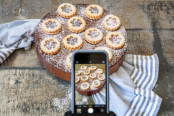 IPhone photos of Linzer cookies with powdered sugar