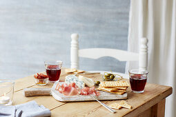 Ham and cheese board with capers and crackers