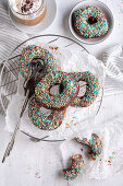 Vegan donuts with dark icing and sugar sprinkles