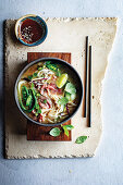 Cheat's Pho with rib eye, bok choy and peas