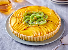 Mango and kiwi tart with passion fruit