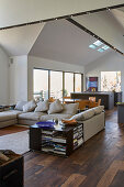 Living room with open plan view of dining area and kitchen