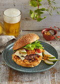 Beef burger with bacon, pear and blue cheese