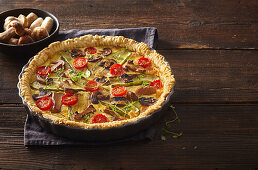 Mushroom quiche with courgettes and cherry tomatoes