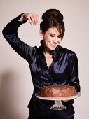 Model with chocolate cake