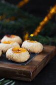 Thumbprint cookies on wooden board