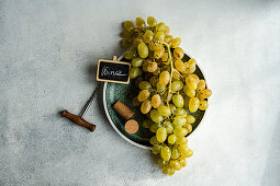 Ripe grapes on the vine on a plate