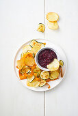 Vegetable crisps with beetroot hummus