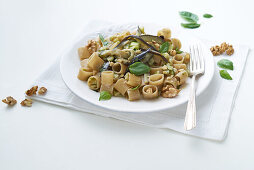 Green lentil pasta with walnuts, courgettes and aubergines