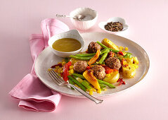 Warm pepper salad with meatballs