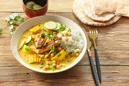Vegetable and chickpea curry with fried halloumi