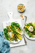 Lukewarm asparagus salad with poached egg and croutons