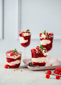 No-bake cheesecake in a jar with raspberries and honey