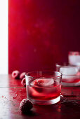 Raspberry cocktail with ice cubes
