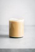 Cold latte in a fluted glass