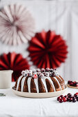 Chocolate cake with icing and cranberries