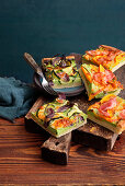 Two kinds of herb quiche with pumpkin, courgette and bacon