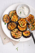 Grilled aubergine slices with herb soya dip