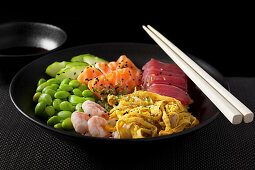 Japanese-style chirashi bowl with tuna and salmon sashimi