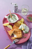 Wholemeal baked fish with herb dip