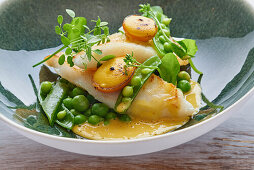 St Peter's fish fillet with peas and kumquat