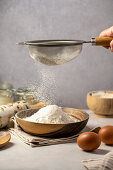 Sift white flour into a bowl