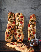 Mediterranean stecca bread with tomatoes, capers and olives