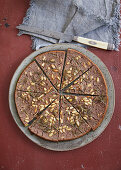 Castagnaccio with sultanas, pine nuts and rosemary