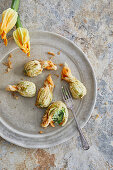 Deep-fried courgette flowers with ricotta and pea filling