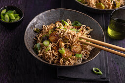 Asian noodle and Brussels sprout pan with cashews and spring onions
