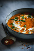 Tomato and lentil soup with cream and parsley