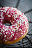 Pink donuts with colorful sprinkles
