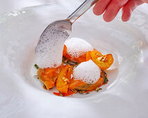 Mussels and pumpkin in curry sauce with lemon foam