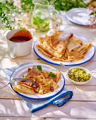 Crêpes with fruit sauce and pistachios