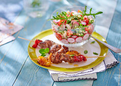 Marinated grilled duck skewers with tabouleh