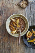 Warm buckwheat and cocoa porridge with caramelised pears