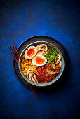 Udon noodle bowl with sweetcorn, eggs and bacon