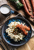 Halusky, Slovak potato gnocchi with sheep cheese bryndza, fried bacon, sausage and chives