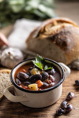 Traditional bean soup with large beans, smoked meat, potatoes and carrots