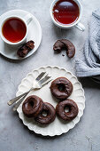 Baked chocolate donuts with glaze