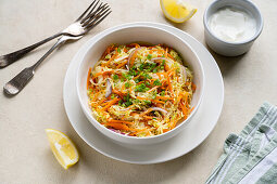 Fresh vegetable salad with carrots and lemon